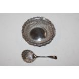 A pierced silver dish and a silver sifter spoon, a
