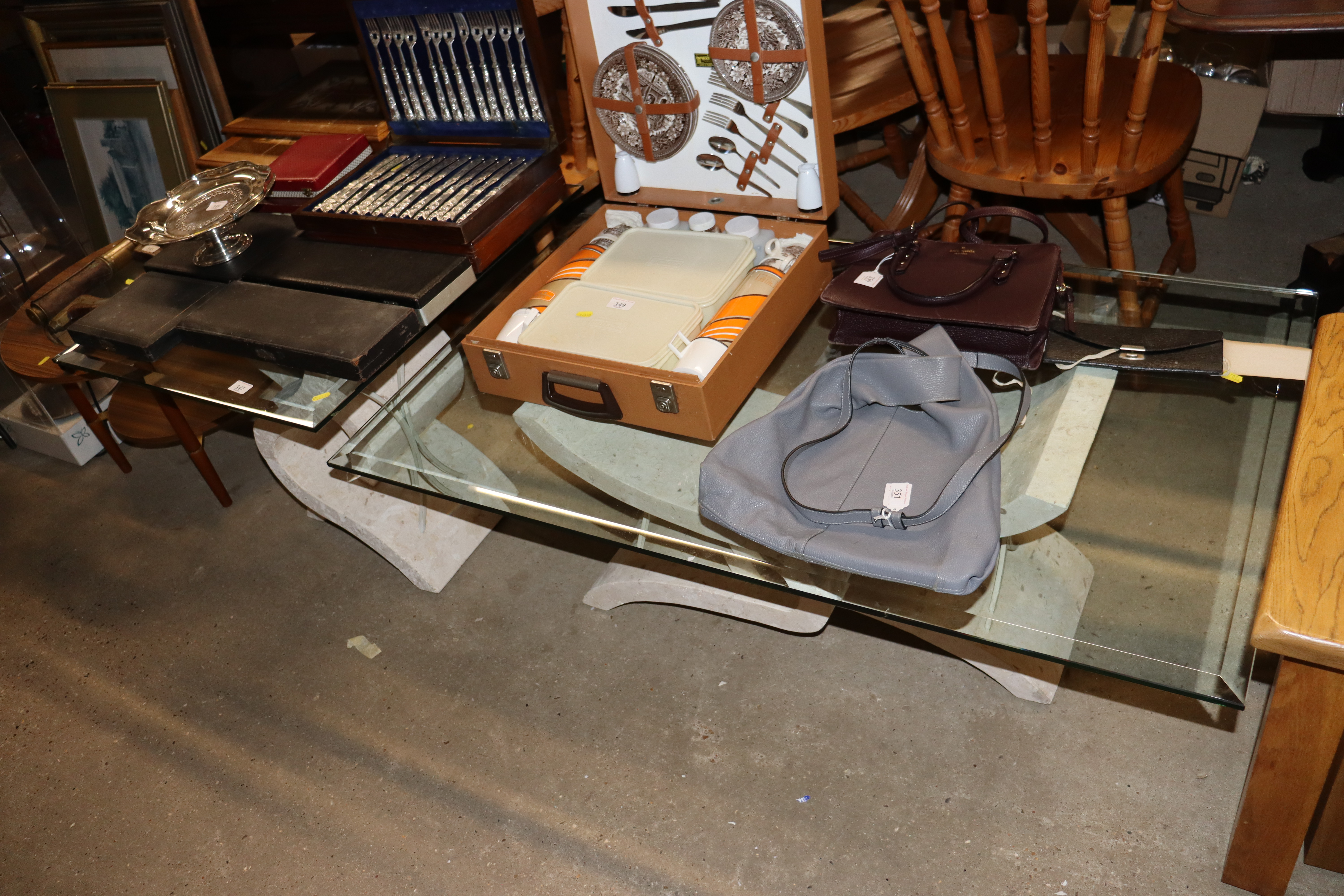 Two similar bevelled edged glass top tables