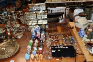 A display rack; souvenir spoons; three display she