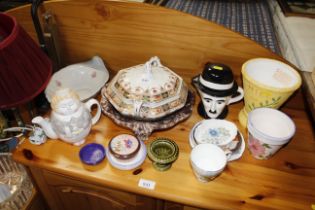 A box of mixed ceramics including Holkham, Rockingham, Wedgwood and a Charlie Chaplin teapot