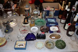 A quantity of various advertising ashtrays, table