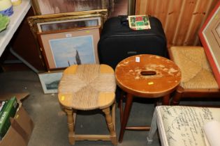 A suitcase and two stools