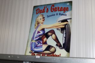 A reproduction 'Dad's Garage' advertising sign