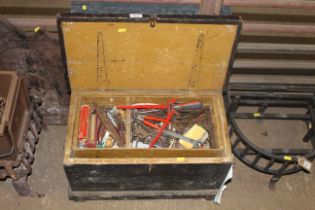 A wooden toolbox with interior tray and contents o