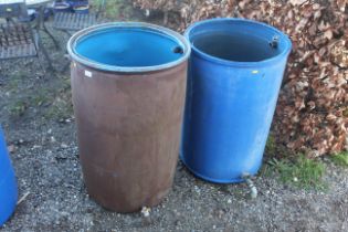 Two plastic containers converted to water butts (l