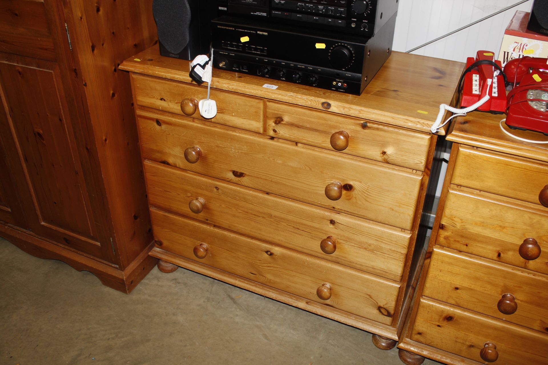 A modern pine chest fitted two short over three lo