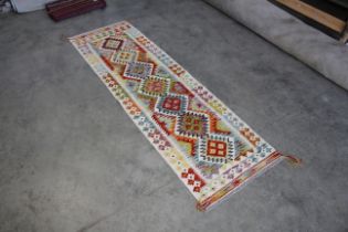 An approx. 6'11" x 2'2" Chobi Kelim rug