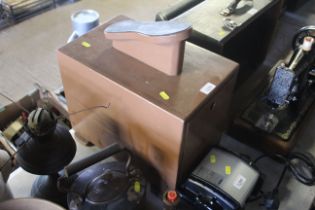 A shoe shiners stand with internal drawer containi