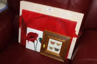 A selection of original poppy paintings on canvas and other prints