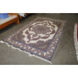 An approx. 10'1" x 6'7" floral patterned rug