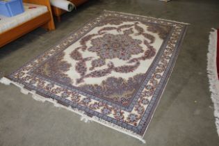 An approx. 10'1" x 6'7" floral patterned rug