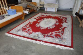 An approx. 12'8" x 9'1" Chinese wool rug AF