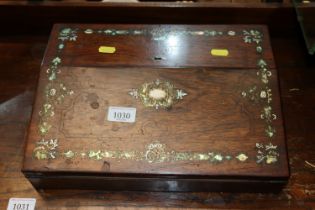 A Victorian rosewood writing box with inlaid decor