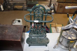 A green painted cast iron stick stand