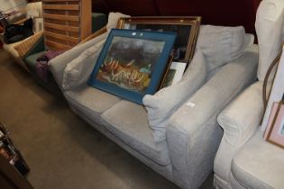 A grey upholstered sofa bed