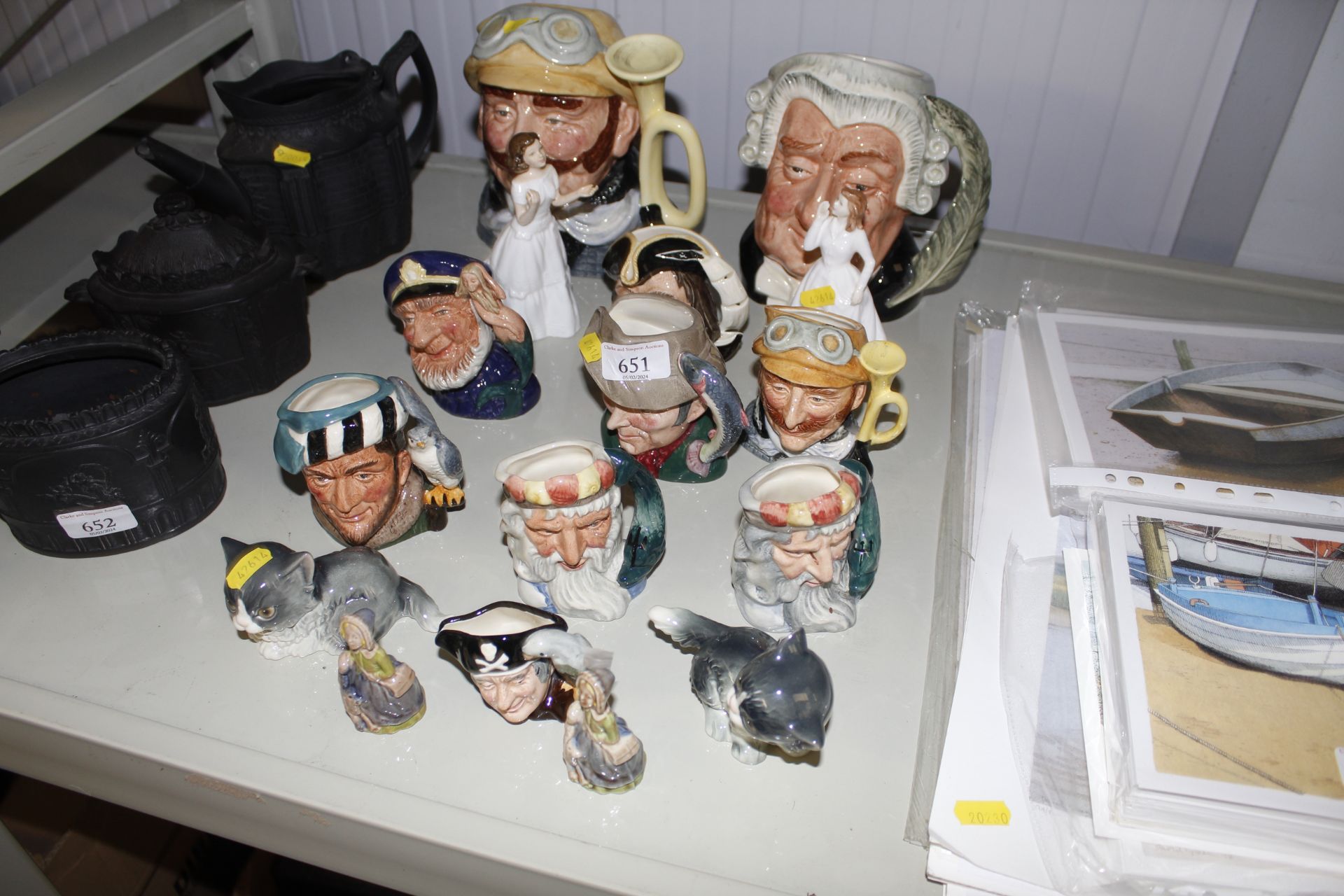 A collection of Royal Doulton character jugs, two