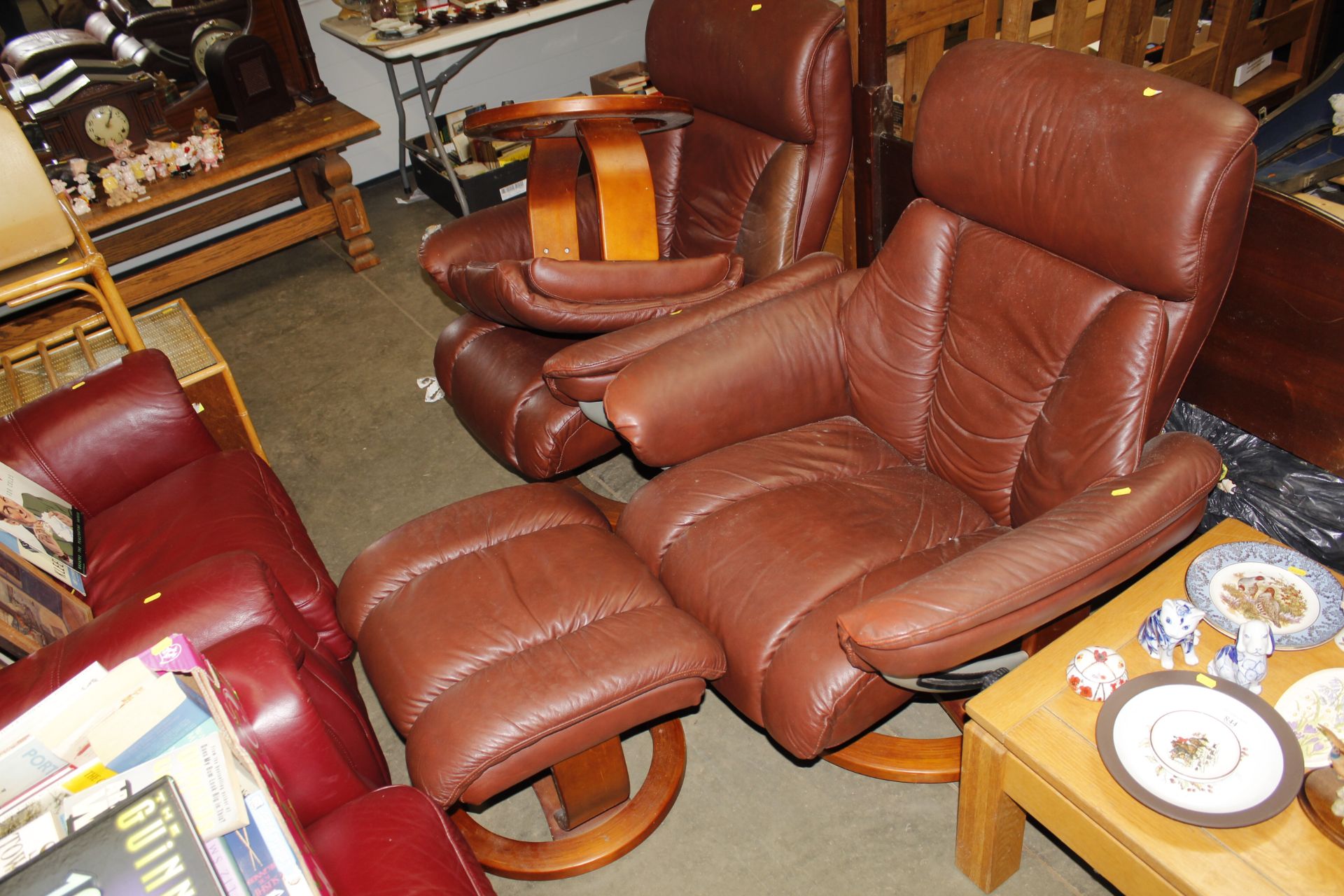 A reclining armchair with matching footstool