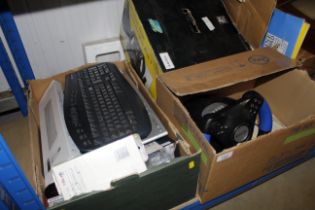 Three boxes containing computer keyboard, computer