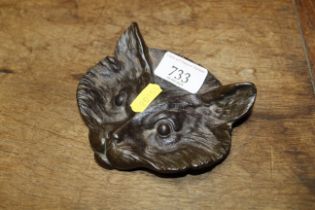 A bronze dish in the form of a cat