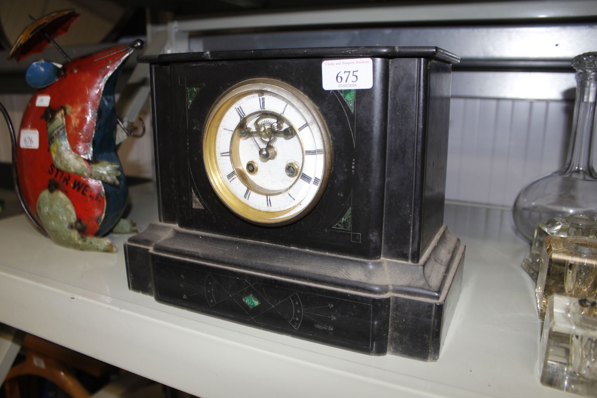 A late Victorian black slate mantle clock AF