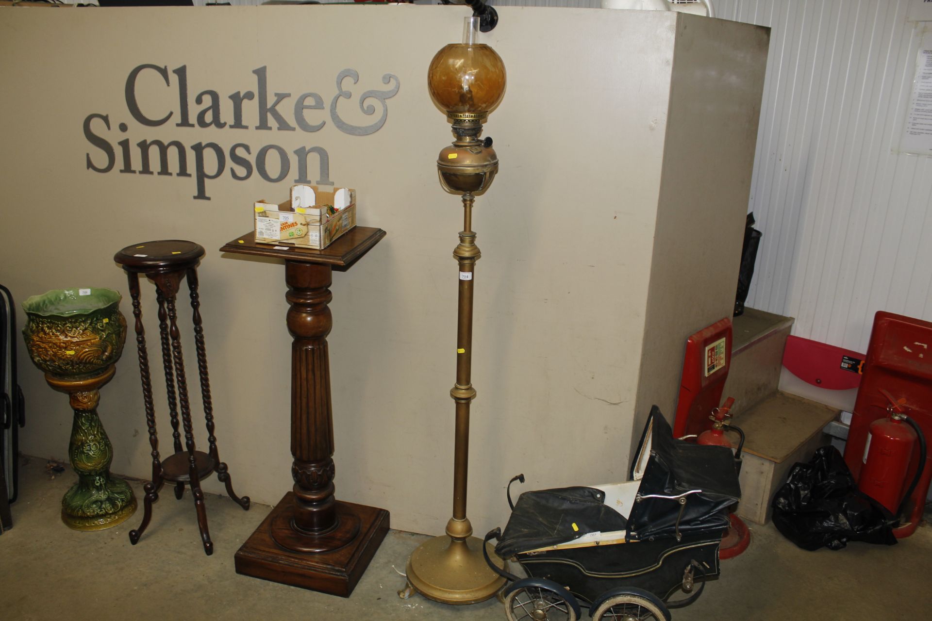 An adjustable brass oil lamp converted to electric