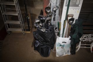 A Taylor Made golf bag and contents of clubs to include Titleist Titanium 975 driver, a quantity