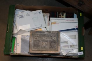 A box containing various first day covers etc