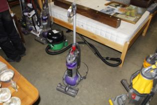 A Dyson DC24 upright vacuum cleaner