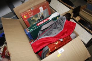 A box containing bags, board game and puzzles