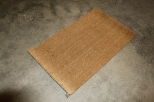 An approx. 3'8" x 2'3" doormat