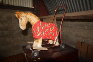 A child's push along toy horse