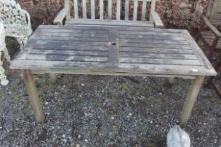 A hardwood four seater garden table