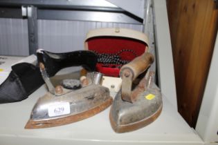 A Globetrotter travel iron and two other irons