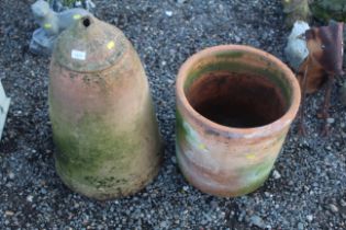 A large terracotta plant pot and a large terracott