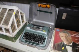 A Good Companion metal cased typewriter