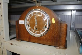 An oak cased three hole mantle clock