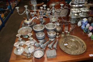 A collection of metalware to include candle sticks