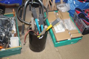 A coal bucket and contents of various tools to inc