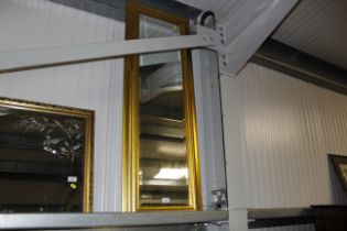 A gilt framed bevelled edged wall mirror