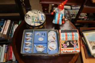 A boxed dolls tea set, vintage toys and a tin of c