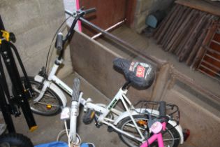 A Rhino Weekend Star folding bicycle with front an