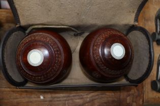 A pair of bowling woods in fitted case