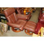 A reclining armchair with matching footstool