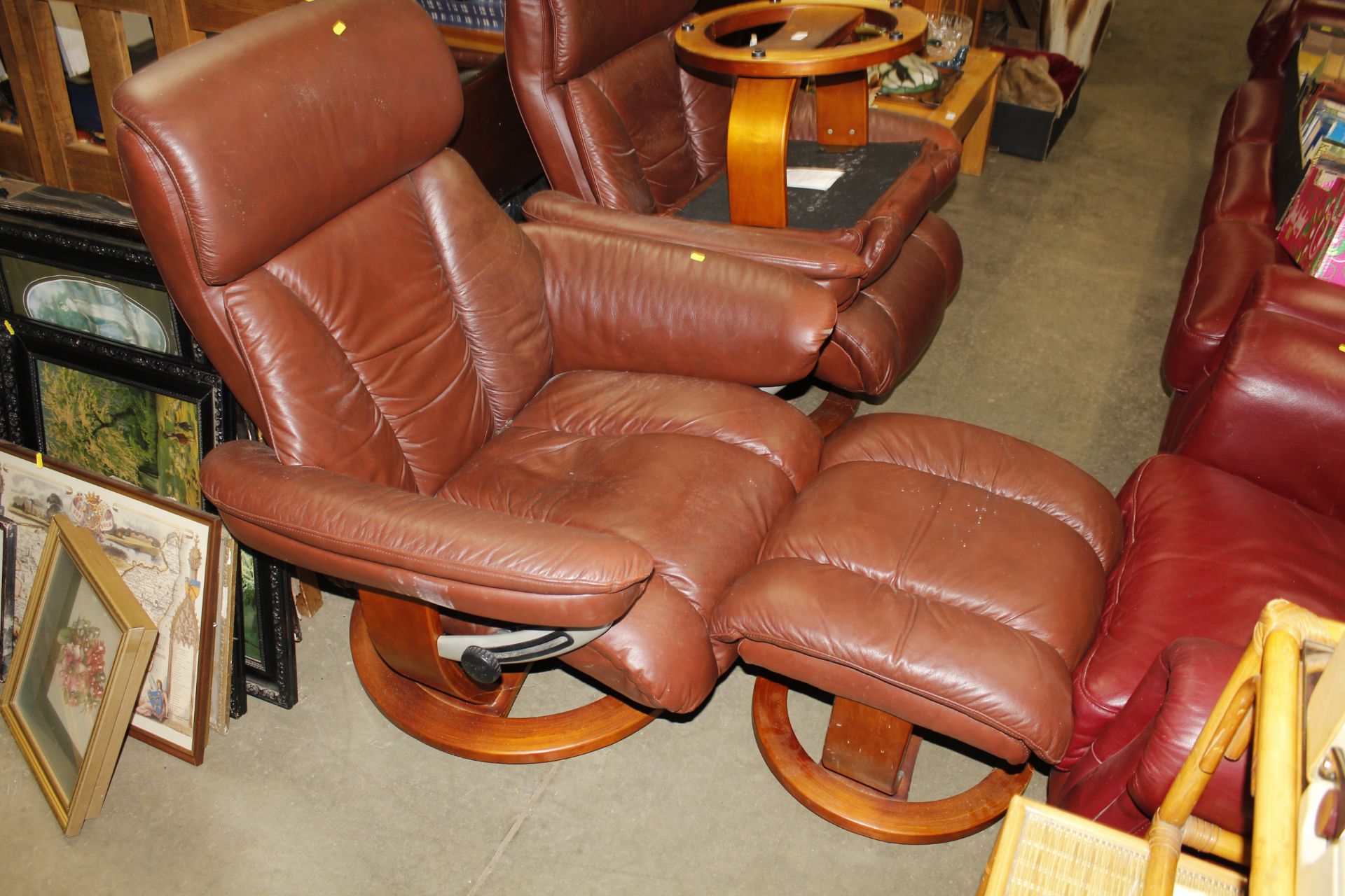 A reclining armchair with matching footstool