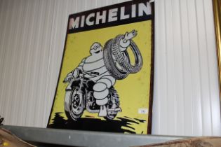 A reproduction Michelin advertising sign