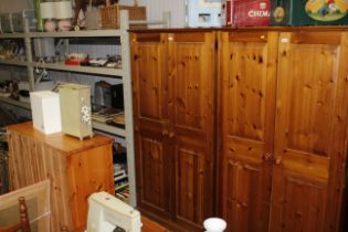 A modern pine two door wardrobe