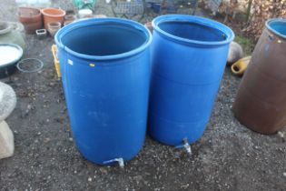 Two plastic containers converted to water butts (l
