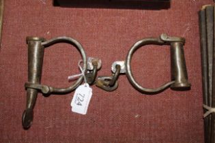 A pair of handcuffs (137)