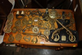 A quantity of various horse brasses, horse bits, b