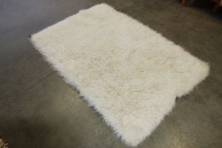 An approx. 6' x 4'1" wool rug